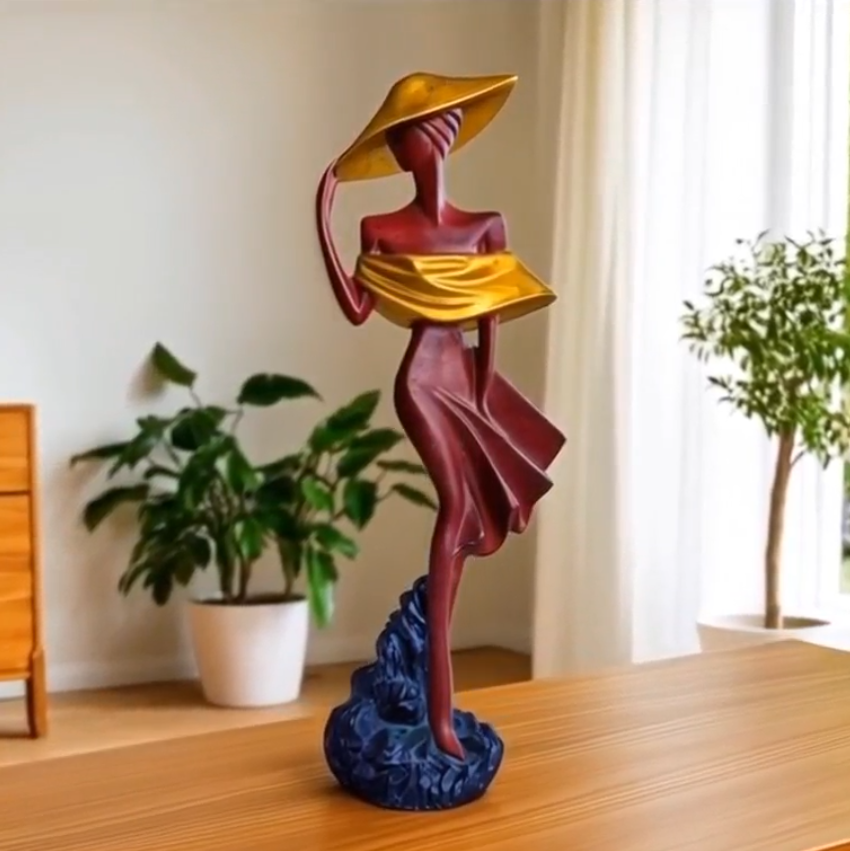 Escultura de dama elegante em marfinite pintada à mão em tons de bordeaux e dourado